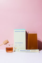 Modern Dose Stress & Mood Balance in Honey box, stick pack, and drink surrounded by honey - www.moderndose.com