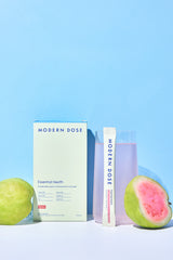 Modern Dose Essential Health box, stick pack, and drink with halved guavas - www.moderndose.com
