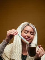a female customer pouring Modern Dose Sleep Aid Salted Caramel into a cup of hot water - www.moderndose.com
