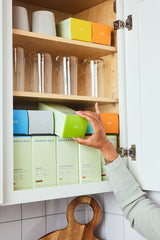 Modern Dose products organized in a kitchen cabinet - moderndose.com